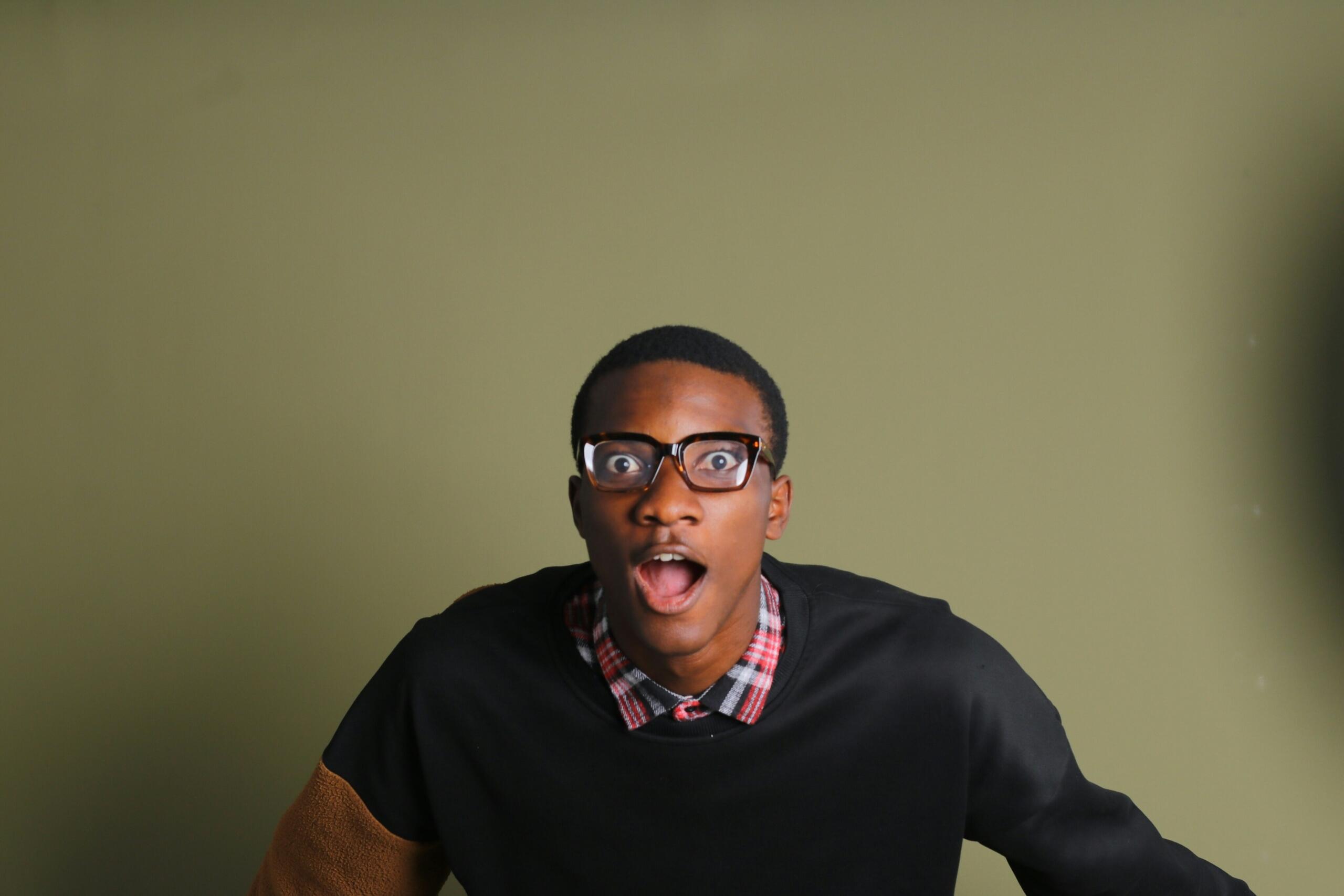 A portrait of a man wearing a very shocked, even horrified expression.