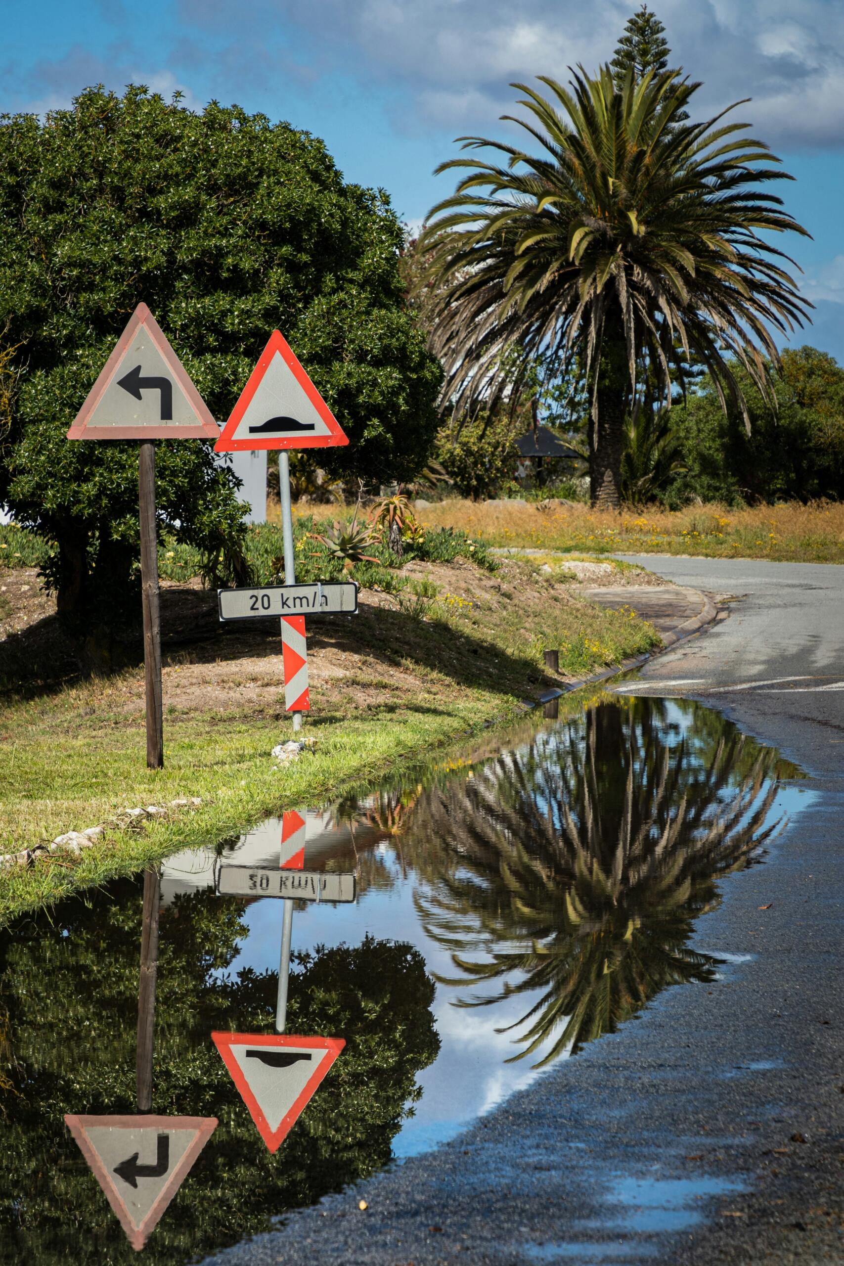 South African W111 sharp junction and W332 speed humps warning signs in Port Owen