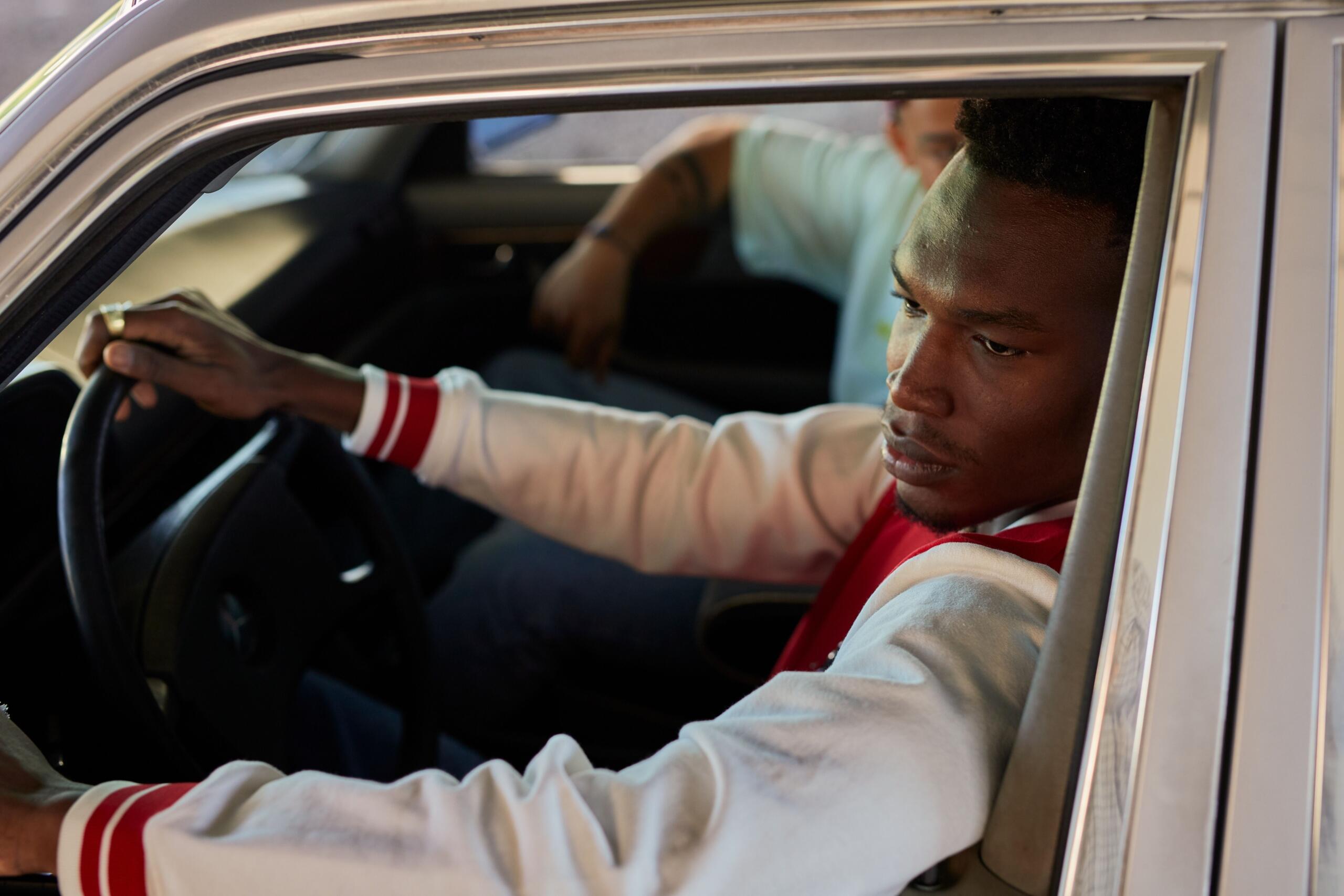 Learner driver taking a practical driving test on the road