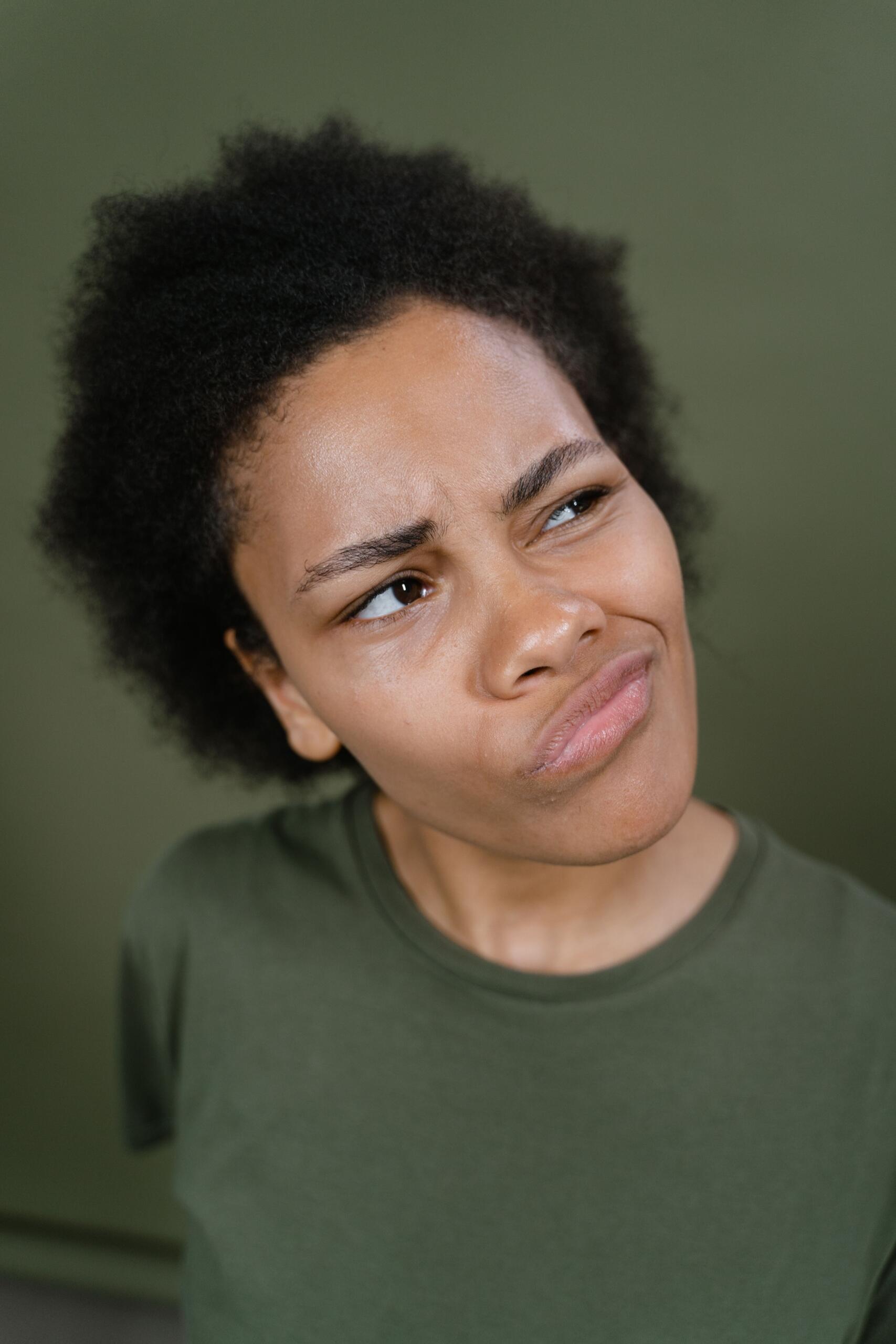 Portrait of a woman looking sceptical.