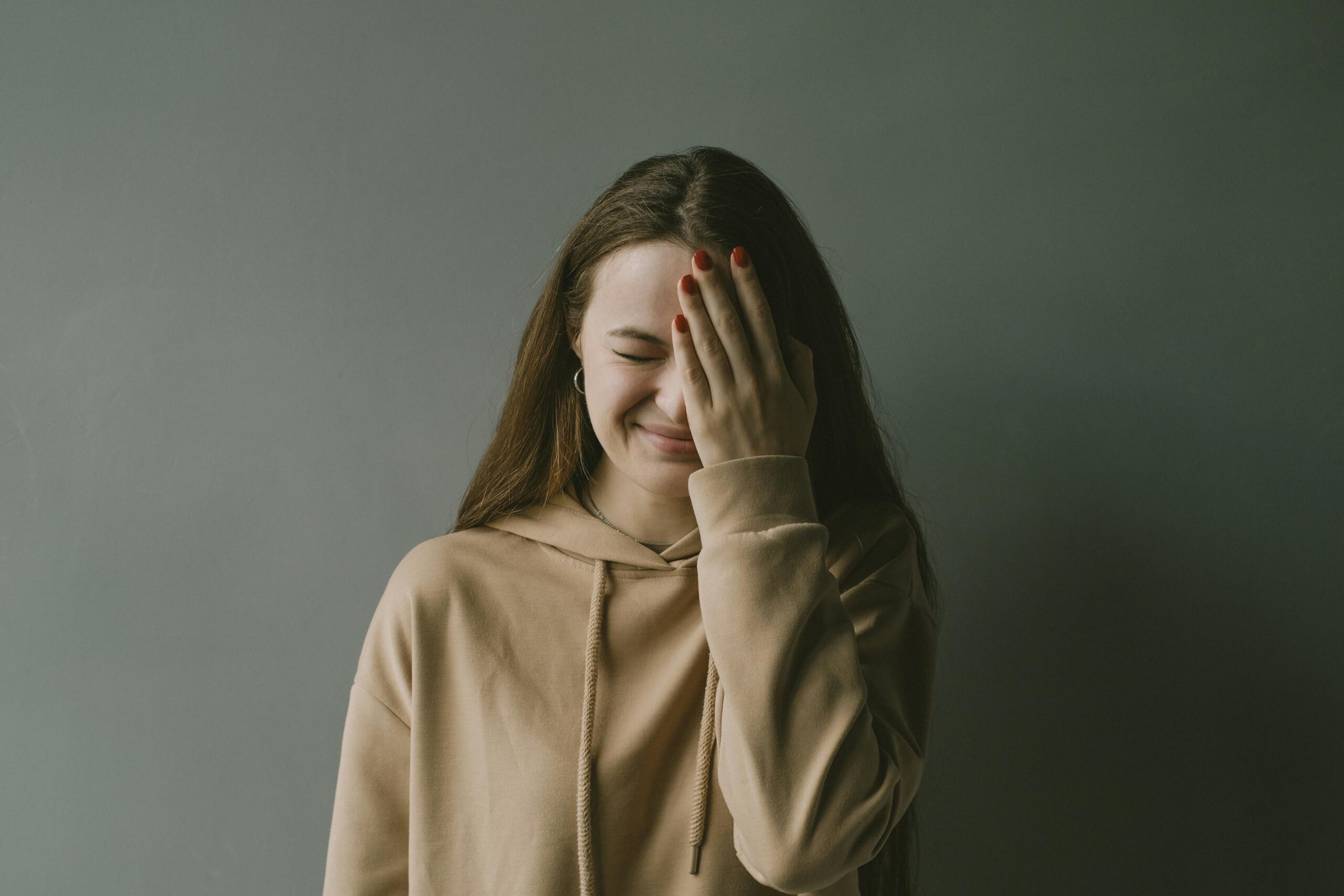 Woman looking annoyed with herself.